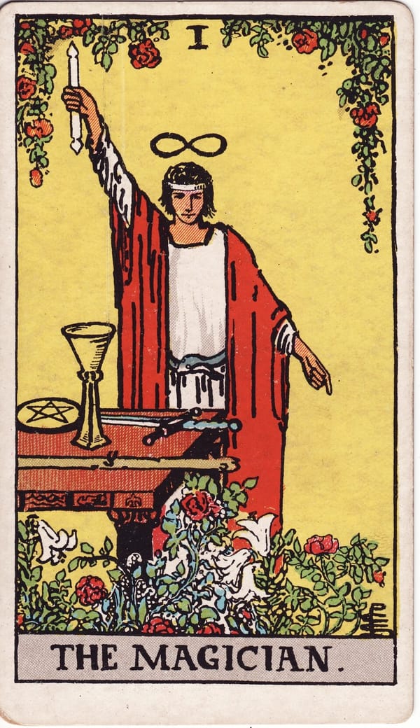 The Magician tarot card: A figure stands with one arm raised to the heavens and one pointing to the earth — 'as above, so below' — channelling higher energy into material form.
